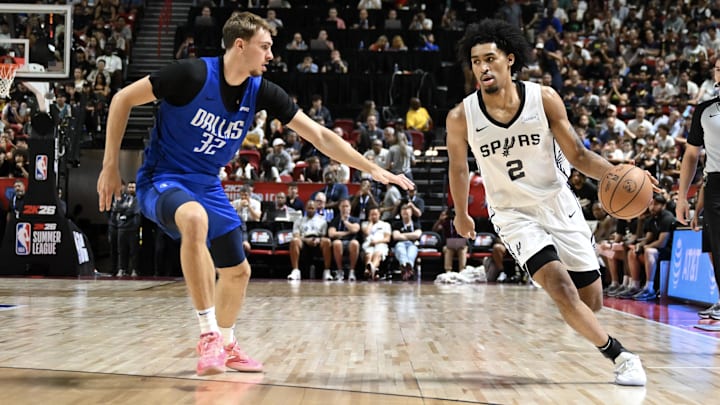 Jul 12, 2025; Las Vegas, NV, USA; Dallas Mavericks forward Cooper Flagg (32) defends against San Antonio Spurs guard Dylan Harper (2) in the second quarter of their game at Thomas & Mack Center. Jul 12, 2025; Las Vegas, NV, USA; Dallas Mavericks forward Cooper Flagg (32) defends against San Antonio Spurs guard Dylan Harper (2) in the second quarter of their game at Thomas & Mack Center.