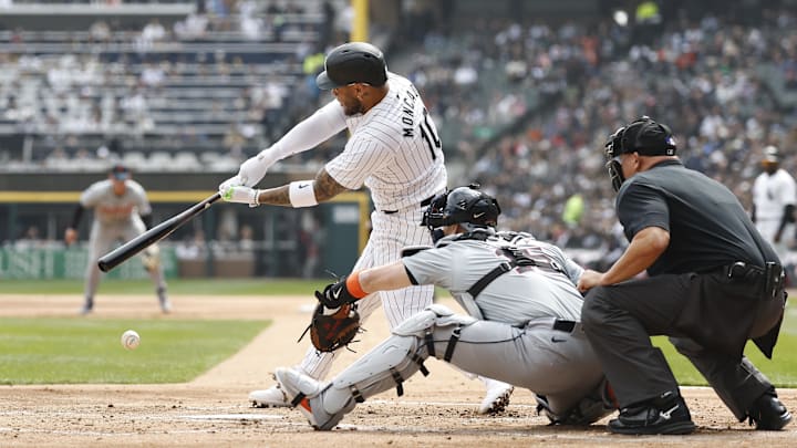 Mar 30, 2024; Chicago, Illinois, USA; Chicago White Sox third baseman Yoan Moncada (10) singles against the Detroit Tigers during the first inning at Guaranteed Rate Field.