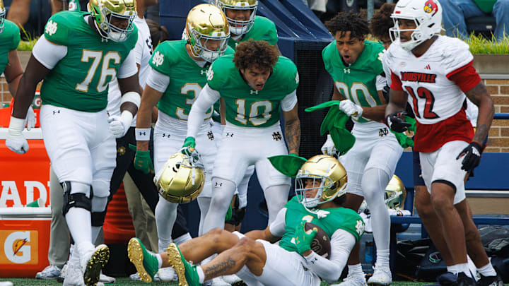 Loghan Thomas (10), Guerby Lambert (76) and Notre Dame teammates celebrate wide receiver Jaden Greathouse's (1) reception during college football game between Notre Dame and Louisville at Notre Dame Stadium on Saturday, Sept. 28, 2024, in South Bend. Loghan Thomas (10), Guerby Lambert (76) and Notre Dame teammates celebrate wide receiver Jaden Greathouse's (1) reception during college football game between Notre Dame and Louisville at Notre Dame Stadium on Saturday, Sept. 28, 2024, in South Bend.