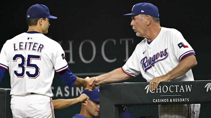 Aug 23, 2025; Arlington, Texas, USA; Texas Rangers manager Bruce Bochy (15) shakes the hand of starting pitcher Jack Leiter (35) as Leiter walks off the field after the seventh inning against the Cleveland Guardians at Globe Life Field. Aug 23, 2025; Arlington, Texas, USA; Texas Rangers manager Bruce Bochy (15) shakes the hand of starting pitcher Jack Leiter (35) as Leiter walks off the field after the seventh inning against the Cleveland Guardians at Globe Life Field.