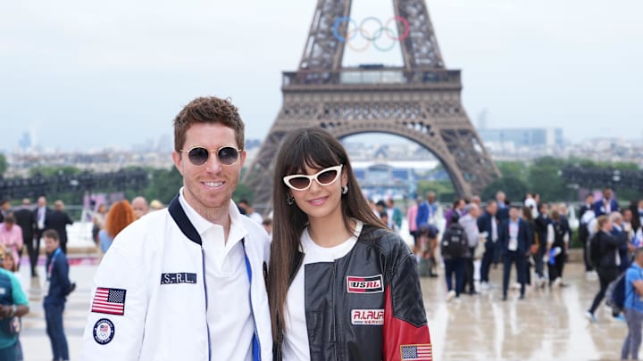 Shaun White and Nina Dobrev arrive on the red carpet during the Opening Ceremony for the Paris 2024 Olympic Summer Games along the Seine River. 