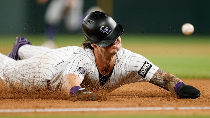 Aug 5, 2025; Denver, Colorado, USA; Colorado Rockies left fielder Jordan Beck (27) slides into third in the sixth inning against the Toronto Blue Jays at Coors Field. 