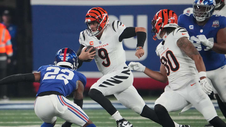 Oct 13, 2024; East Rutherford, New Jersey, USA; Cincinnati Bengals quarterback Joe Burrow (9) runs the ball against the New York Giants during the first quarter at MetLife Stadium. Mandatory Credit: Robert Deutsch-Imagn Images Oct 13, 2024; East Rutherford, New Jersey, USA; Cincinnati Bengals quarterback Joe Burrow (9) runs the ball against the New York Giants during the first quarter at MetLife Stadium. Mandatory Credit: Robert Deutsch-Imagn Images
