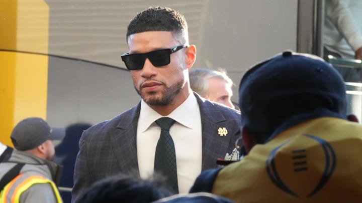 Jan 20, 2025; Atlanta, GA, USA; Notre Dame Fighting Irish head coach Marcus Freeman arrives before playing against the Ohio State Buckeyes in the CFP National Championship college football game at Mercedes-Benz Stadium. Mandatory Credit: Kirby Lee-Imagn Images Jan 20, 2025; Atlanta, GA, USA; Notre Dame Fighting Irish head coach Marcus Freeman arrives before playing against the Ohio State Buckeyes in the CFP National Championship college football game at Mercedes-Benz Stadium. Mandatory Credit: Kirby Lee-Imagn Images