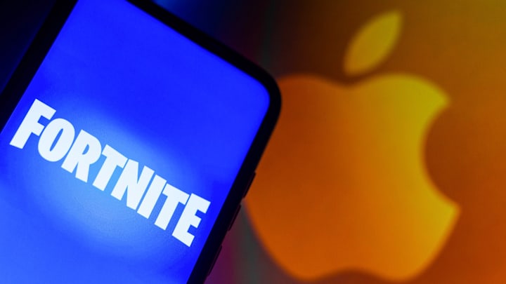 In this photo illustration the Fortnite logo seen displayed...