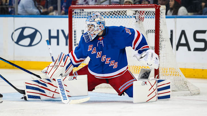 Mar 22, 2025; New York, New York, USA; New York Rangers goalie Igor Shesterkin (31) makes a save against the Vancouver Canucks during the second period at Madison Square Garden. Mandatory Credit: Danny Wild-Imagn Images