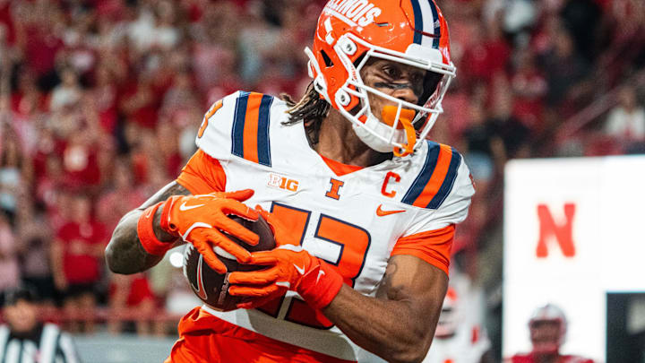 Sep 20, 2024; Lincoln, Nebraska, USA; Illinois Fighting Illini wide receiver Pat Bryant scores a touchdown in overtime against the Nebraska Cornhuskers at Memorial Stadium.
