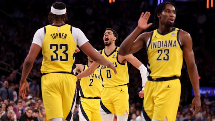 May 19, 2024; New York, New York, USA; Indiana Pacers guard Tyrese Haliburton (0) reacts with center Myles Turner (33) and guard Andrew Nembhard (2) and forward Aaron Nesmith (23) during the second quarter of game seven of the second round of the 2024 NBA playoffs at Madison Square Garden. Mandatory Credit: Brad Penner-Imagn Images