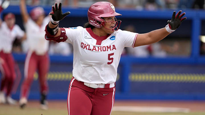 Oklahoma infielder Ella Parker (5) celebrates after hitting a walk-off home run to drive in three runs in the seventh inning of a Women's College World Series softball game between the Oklahoma Sooners (OU) and the Tennessee Volunteers at Devon Park in Oklahoma City in 2025. Parker hit two home runs Saturday in OU's win over Louisiana.