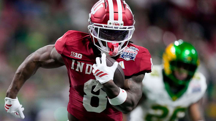 Indiana Hoosiers running back Kaelon Black (8) rushes the ball for a touchdown Friday, Jan. 9, 2026, during the Peach Bowl and semifinal game of the College Football Playoff against the Oregon Ducks at Mercedes-Benz Stadium in Atlanta.