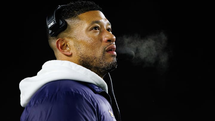 Notre Dame head coach Marcus Freeman looks up at the scoreboard during the first round of the College Football Playoff between Notre Dame and Indiana at Notre Dame Stadium on Friday, Dec. 20, 2024, in South Bend.