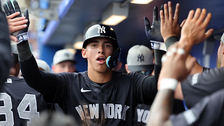 Feb 22, 2025; Dunedin, Florida, USA; New York Yankees shortstop George Lombard Jr. (96) is congratulated after he scored a run during the sixth inning against the Toronto Blue Jays at TD Ballpark. Feb 22, 2025; Dunedin, Florida, USA; New York Yankees shortstop George Lombard Jr. (96) is congratulated after he scored a run during the sixth inning against the Toronto Blue Jays at TD Ballpark.