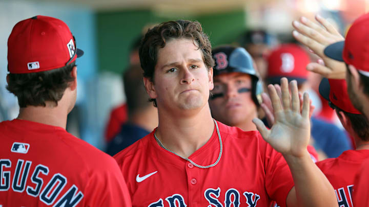 Feb 28, 2025; Clearwater, Florida, USA; Boston Red Sox outfielder Roman Anthony (48) is congratulated after he scored a run against the Philadelphia Phillies  during the third inning  at BayCare Ballpark. Mandatory Credit: Kim Klement Neitzel-Imagn Images