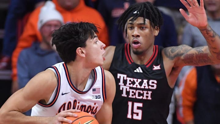 Nov 11, 2025; Champaign, Illinois, USA; Texas Tech Red Raiders forward JT Toppin (15) defends against Illinois Fighting Illini guard Andrej Stojakovic (2) during the second half at State Farm Center. Mandatory Credit: Ron Johnson-Imagn Images