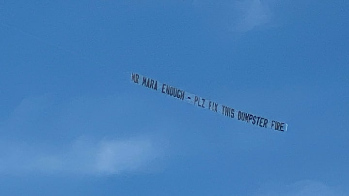 A banner is being flown from an airplane above MetLife Stadium, imploring New York Giants team ownership to fix the team.