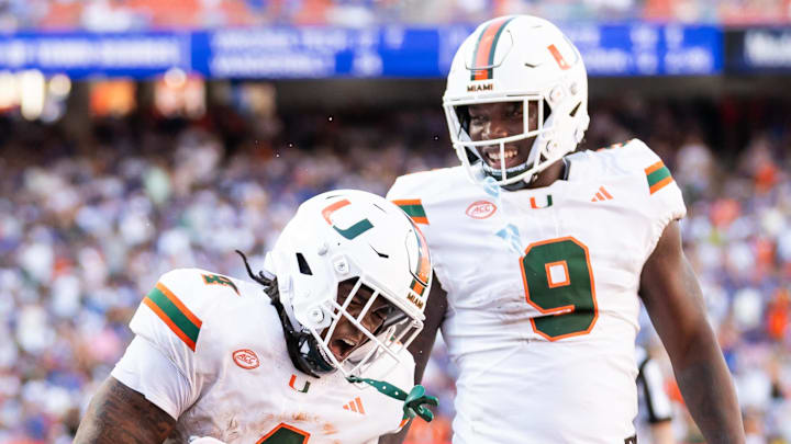 Aug 31, 2024; Gainesville, Florida, USA; Miami Hurricanes running back Mark Fletcher Jr. (4) and Miami Hurricanes tight end Elija Lofton (9) celebrate after a touchdown against the Florida Gators during the second half at Ben Hill Griffin Stadium. Mandatory Credit: Matt Pendleton-Imagn Images Aug 31, 2024; Gainesville, Florida, USA; Miami Hurricanes running back Mark Fletcher Jr. (4) and Miami Hurricanes tight end Elija Lofton (9) celebrate after a touchdown against the Florida Gators during the second half at Ben Hill Griffin Stadium. Mandatory Credit: Matt Pendleton-Imagn Images