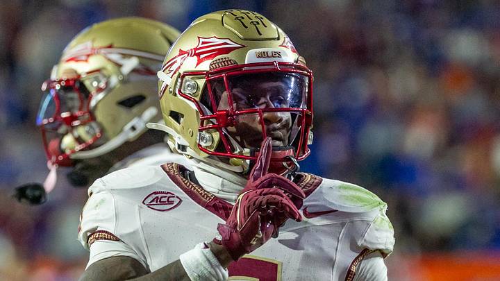 Florida State Seminoles defensive back Edwin Joseph silences the crowd after an interception during the second quarter against the Florida Gators at Ben Hill Griffin Stadium. Florida State Seminoles defensive back Edwin Joseph silences the crowd after an interception during the second quarter against the Florida Gators at Ben Hill Griffin Stadium.