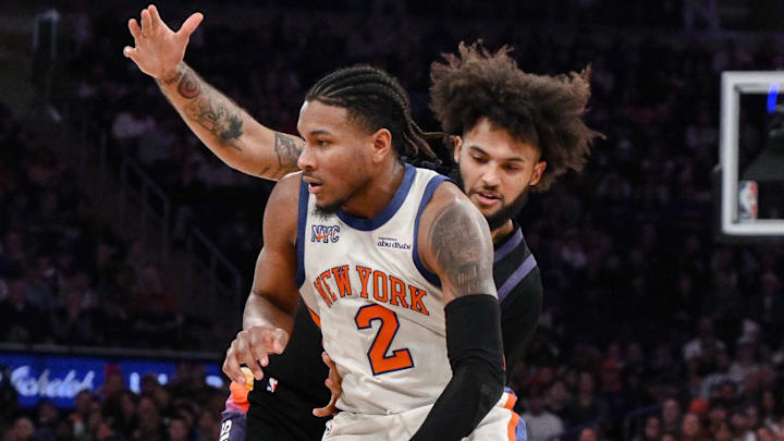 Jan 17, 2026; New York, New York, USA; New York Knicks guard Miles McBride (2) drives past Phoenix Suns forward Isaiah Livers (18) during the first half at Madison Square Garden. Mandatory Credit: John Jones-Imagn Images