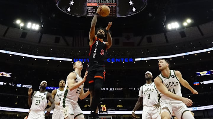 Mar 1, 2024; Chicago, Illinois, USA; Milwaukee Bucks guard AJ Green (20) defends Chicago Bulls guard Coby White (0) during the second half at United Center. Mandatory Credit: David Banks-Imagn Images