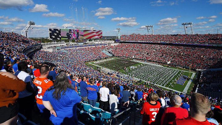 The Florida and Georgia marching bands share the field during Saturday's pregame show. The Florida Gators went into the half trailing the Georgia Bulldogs 24 to 0. The Florida Gators were the home team for this years annual Florida vs Georgia college football rivalry game at TIAA Bank field in Jacksonville, Florida Saturday, October 30, 2021. [Bob Self/Florida Times-Union]