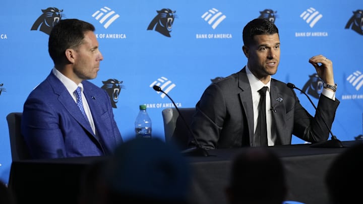 Feb 1, 2024; Charlotte, NC, USA; Carolina Panthers head coach Dave Canales speaks to the media as general manager Dan Morgan looks on during the introductory press conference at Bank of America Stadium