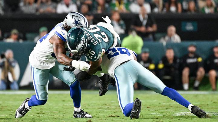 Philadelphia Eagles running back Saquon Barkley (26) is tackled by Dallas Cowboys defensive end Sam Williams (54) and cornerback Kaiir Elam (20) during the second quarter of the game at Lincoln Financial Field. Mandatory Credit: Eric Hartline-Imagn Images Philadelphia Eagles running back Saquon Barkley (26) is tackled by Dallas Cowboys defensive end Sam Williams (54) and cornerback Kaiir Elam (20) during the second quarter of the game at Lincoln Financial Field. Mandatory Credit: Eric Hartline-Imagn Images