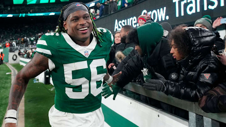 New York Jets linebacker Quincy Williams (56) gives high-fives to fans after Gang Green who their final game of the season, 32-20, Sunday January 5, 2025, in East Rutherford.