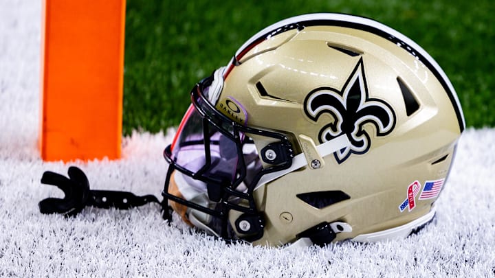 Sep 8, 2024; New Orleans, Louisiana, USA;  Detailed view of the New Orleans Saints football helmet before the game against the Carolina Panthers during the pregame at Caesars Superdome.  