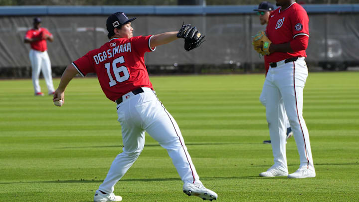 Washington Nationals pitcher Shinnosuke Ogasawara (16) warms up before Spring Training activities. 