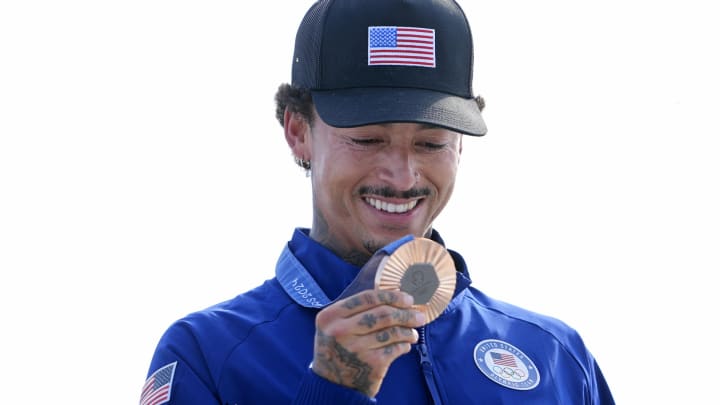 Jul 29, 2024; Paris, France; Nyjah Huston of the United States looks at his bronze medal in the menís street finals during the Paris 2024 Olympic Summer Games at La Concorde 3. Jul 29, 2024; Paris, France; Nyjah Huston of the United States looks at his bronze medal in the menís street finals during the Paris 2024 Olympic Summer Games at La Concorde 3.