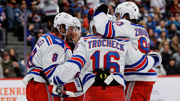 Nov 20, 2025; Denver, Colorado, USA; New York Rangers center J.T. Miller (8) celebrates his goal with center Vincent Trocheck (16) and center Mika Zibanejad (93) in the first period against the Colorado Avalanche at Ball Arena. Mandatory Credit: Isaiah J. Downing-Imagn Images