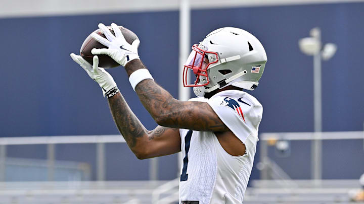 Jun 9, 2025; Foxborough, MA, USA; New England Patriots wide receiver Ja'Lynn Polk (1) makes a catch during minicamp at Gillette Stadium. Mandatory Credit: Eric Canha-Imagn Images