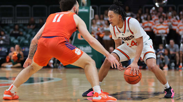 Dec 7, 2024; Coral Gables, Florida, USA; Miami Hurricanes guard Nijel Pack (24) dribbles the basketball as Clemson Tigers guard Jaeden Zackery (11) defends during the second half at Watsco Center. Mandatory Credit: Sam Navarro-Imagn Images Dec 7, 2024; Coral Gables, Florida, USA; Miami Hurricanes guard Nijel Pack (24) dribbles the basketball as Clemson Tigers guard Jaeden Zackery (11) defends during the second half at Watsco Center. Mandatory Credit: Sam Navarro-Imagn Images