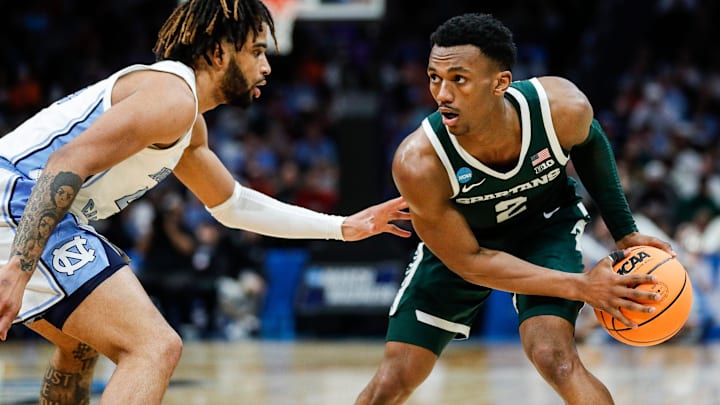 Michigan State guard Tyson Walker (2) dribbles against North Carolina guard RJ Davis (4) during the second half of the NCAA tournament West Region second round at Spectrum Center in Charlotte, N.C. on Saturday, March 23, 2024.