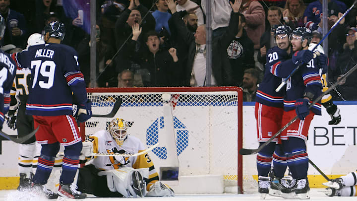 K'Andre Miller, Chris Kreider, and Reilly Smith celebrate a goal