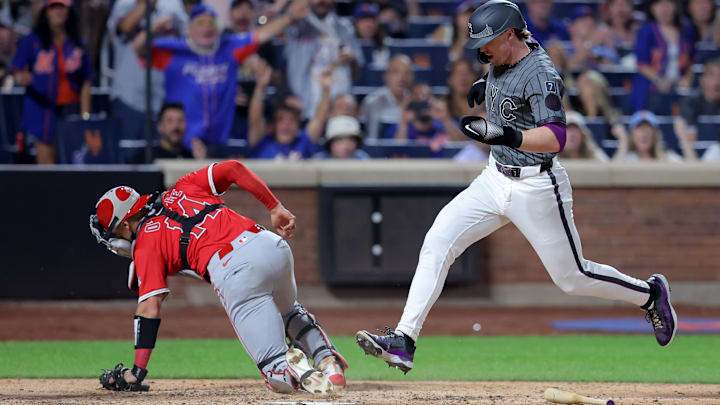 New York Mets third baseman Brett Baty (7) scores a run against Los Angeles Angels catcher Logan O'Hoppe (14) on a fielders choice ground ball by Mets pinch hitter Ronny Mauricio (not pictured) during the eighth inning at Citi Field on Monday.
