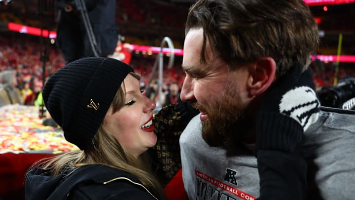 Jan 26, 2025; Recording artist Taylor Swift and Kansas City Chiefs tight end Travis Kelce (87) react after the AFC Championship game against the Buffalo Bills at GEHA Field at Arrowhead Stadium. Jan 26, 2025; Recording artist Taylor Swift and Kansas City Chiefs tight end Travis Kelce (87) react after the AFC Championship game against the Buffalo Bills at GEHA Field at Arrowhead Stadium.