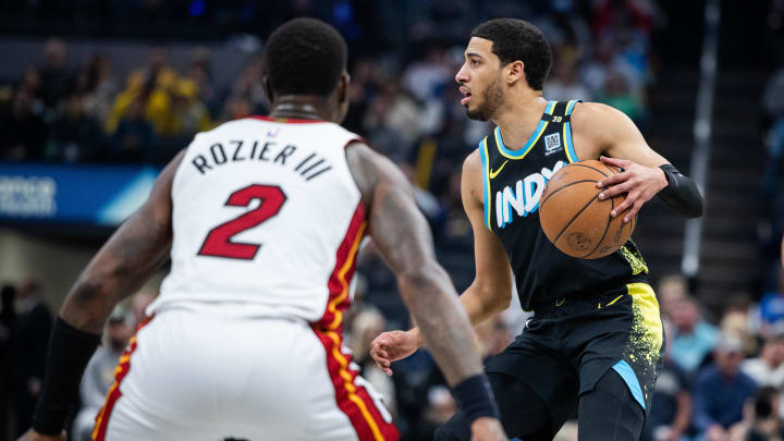 Apr 7, 2024; Indianapolis, Indiana, USA; Indiana Pacers guard Tyrese Haliburton (0) dribbles the ball while Miami Heat guard Terry Rozier (2) defends in the first half at Gainbridge Fieldhouse. Mandatory Credit: Trevor Ruszkowski-USA TODAY Sports