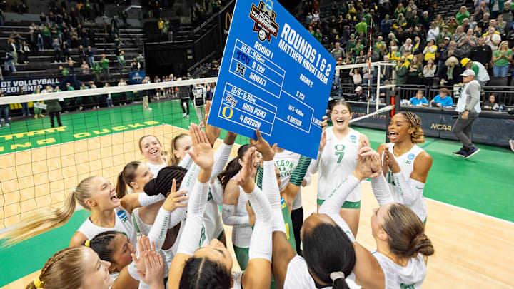 Oregon players cheer after their win as the Oregon Ducks host the TCU Horned Frogs in the second round of the NCAA volleyball tournament on Friday, Dec. 6, 2024, at Matthew Knight Arena in Eugene, Ore.