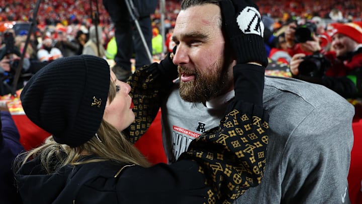 Jan 26, 2025; Kansas City, MO, USA; Recording artist Taylor Swift  and Kansas City Chiefs tight end Travis Kelce (87) react after the AFC Championship game against the Buffalo Bills at GEHA Field at Arrowhead Stadium. Mandatory Credit: Mark J. Rebilas-Imagn Images