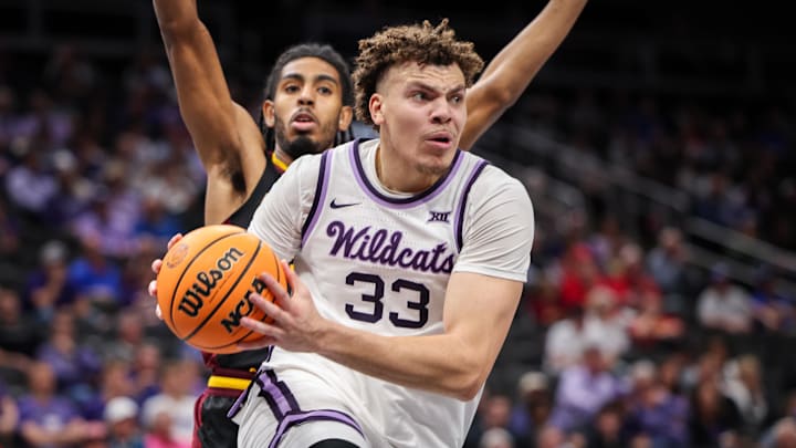 Mar 11, 2025; Kansas City, MO, USA; Kansas State Wildcats guard Coleman Hawkins (33) drives to the basket during the first half against the Arizona State Sun Devils at T-Mobile Center. Mandatory Credit: William Purnell-Imagn Images