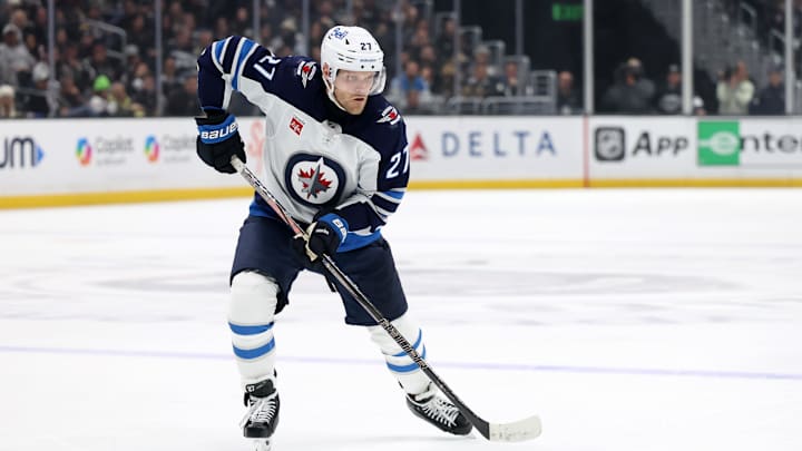 Apr 1, 2025; Los Angeles, California, USA;  Winnipeg Jets left wing Nikolaj Ehlers (27) skates with the puck during the third period against the Los Angeles Kings at Crypto.com Arena. Mandatory Credit: Kiyoshi Mio-Imagn Images