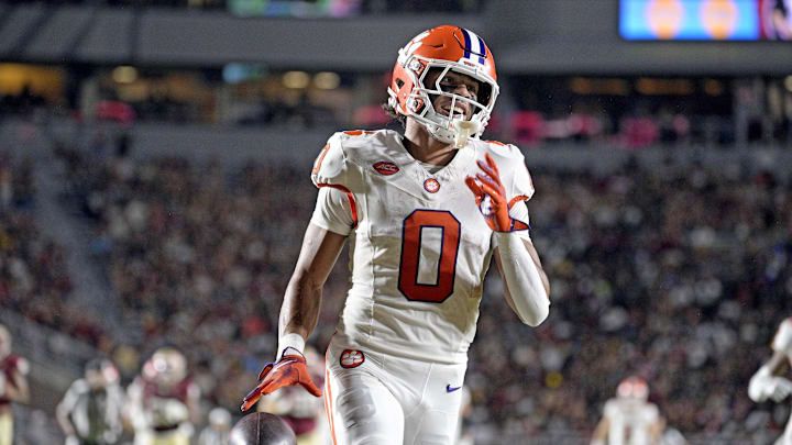 Oct 5, 2024; Tallahassee, Florida, USA; Clemson Tigers wide receiver Antonio Williams (0) scores a touchdown against the Florida State Seminoles during the first half at Doak S. Campbell Stadium. Mandatory Credit: Melina Myers-Imagn Images