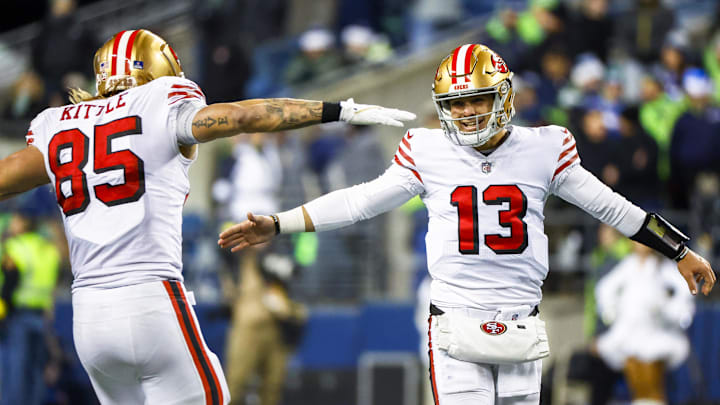 San Francisco 49ers quarterback Brock Purdy (13) with tight end George Kittle (85)