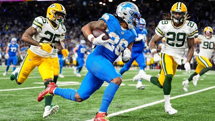 Detroit Lions running back Jahmyr Gibbs runs for a first down against Green Bay Packers safety Xavier McKinney (29) during the second half at Ford Field in Detroit on Thursday, Dec. 5, 2024. Detroit Lions running back Jahmyr Gibbs runs for a first down against Green Bay Packers safety Xavier McKinney (29) during the second half at Ford Field in Detroit on Thursday, Dec. 5, 2024.