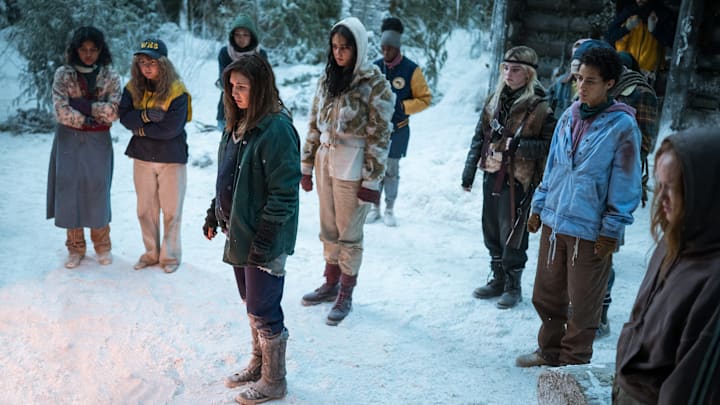 (L-R): Nuha Jes Izman as Teen Crystal, Samantha Hanratty as Teen Misty, Alexa Barajas as Teen Mari, Sophie Nélisse as Teen Shauna, Courtney Eaton as Teen Lottie, Nia Sondaya as Teen Akilah, Sophie Thatcher as Teen Natalie, Jasmin Savoy Brown as Teen Taissa, Steven Krueger as Ben Scott and Liv Hewson as Teen Van in YELLOWJACKETS, Season 2. Photo Credit: Kailey Schwerman/SHOWTIME.