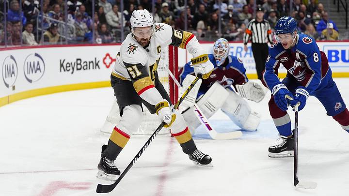Apr 8, 2025; Denver, Colorado, USA; Vegas Golden Knights right wing Mark Stone (61) passes the puck away from Colorado Avalanche defenseman Cale Makar (8) in the first period at Ball Arena. Mandatory Credit: Ron Chenoy-Imagn Images Apr 8, 2025; Denver, Colorado, USA; Vegas Golden Knights right wing Mark Stone (61) passes the puck away from Colorado Avalanche defenseman Cale Makar (8) in the first period at Ball Arena. Mandatory Credit: Ron Chenoy-Imagn Images