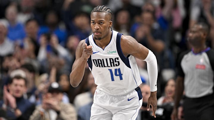 Feb 5, 2026; Dallas, Texas, USA; Dallas Mavericks guard Miles Kelly (14) celebrates making a three point basket against the San Antonio Spurs during the second half at the American Airlines Center.