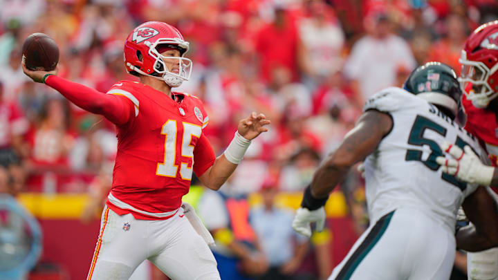 Sep 14, 2025; Kansas City, Missouri, USA; Kansas City Chiefs quarterback Patrick Mahomes (15) passes the ball against the Philadelphia Eagles during the fourth quarter of the game at GEHA Field at Arrowhead Stadium. Mandatory Credit: Jay Biggerstaff-Imagn Images