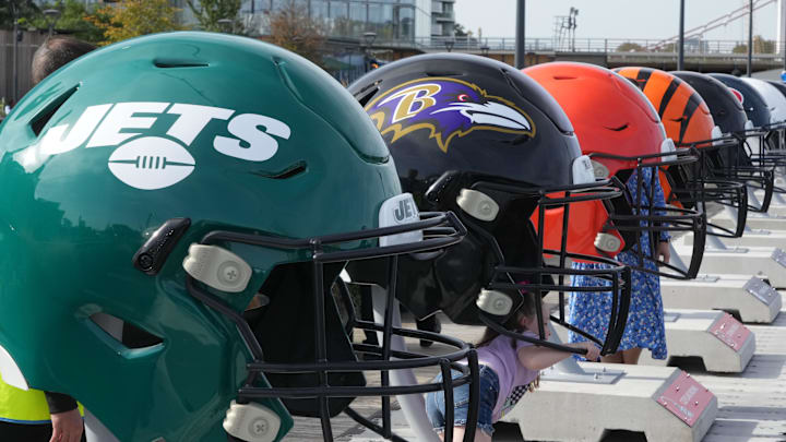 Oct 7, 2023; London, United Kingdom; Large oversized helmets of the New York Jets Baltimore Ravens, Cleveland Browns and Cincinnati Bengals at the NFL Experience London at the Battersea Power Station. Mandatory Credit: Kirby Lee-Imagn Images